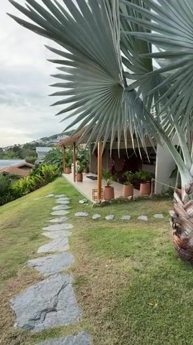 Morning activity at a Ko Samui resort: pool, yoga, and tropical grounds