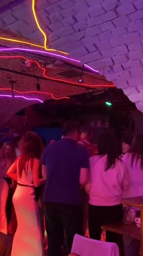 Evening social gathering captured at Saratov nightlife venue
