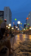 Seoul waterway draws evening crowds under decorative lanterns