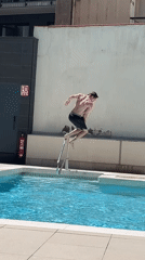 Young man enjoys rooftop pool morning in Barcelona