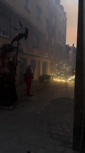 Traditional festival with costumed performers, floats observed in Barcelona