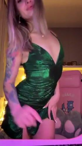 Woman dances in green dress, others watch film in Reutov
