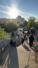 Group walks down train station overpass in Lyubertsy
