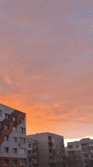 Sunset with orange-pink clouds captured over Pernik buildings