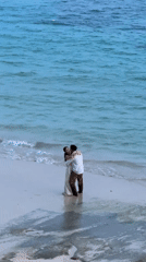 Couple stages beach photoshoot in formal attire, Kuta Selatan