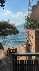 Afternoon on the Bay of Kotor: water, boats, and a seaside restaurant