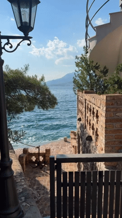 Afternoon on the Bay of Kotor: water, boats, and a seaside restaurant