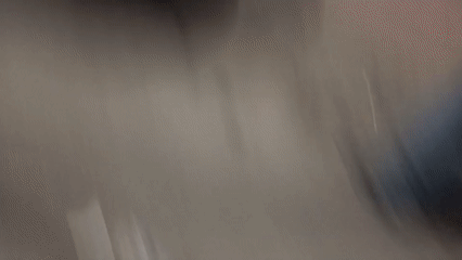 Nighttime street scene captured in shaky mobile footage