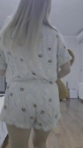 Woman documents casual moments with teddy bear in Sevastopol home
