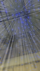 Illuminated strand art installation observed in Milan