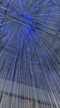 Illuminated strand art installation observed in Milan
