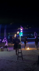Fire juggler performs on Thailand beach during Full Moon Party