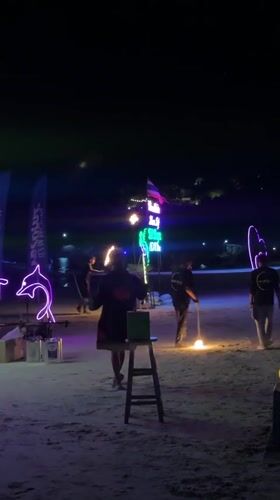 Fire juggler performs on Thailand beach during Full Moon Party