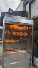 Rotisserie chickens cooking on spits observed in Sofia