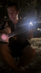 Informal beach music session captured in Pattaya City, Thailand