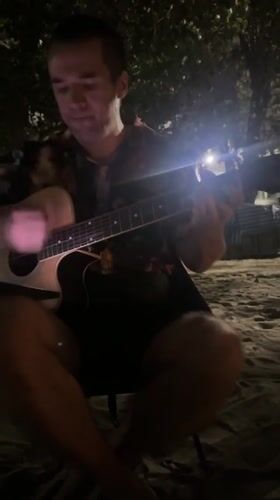 Informal beach music session captured in Pattaya City, Thailand