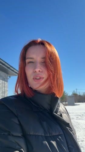 Woman films outdoor selfies with dog in snowy Chaykovsky