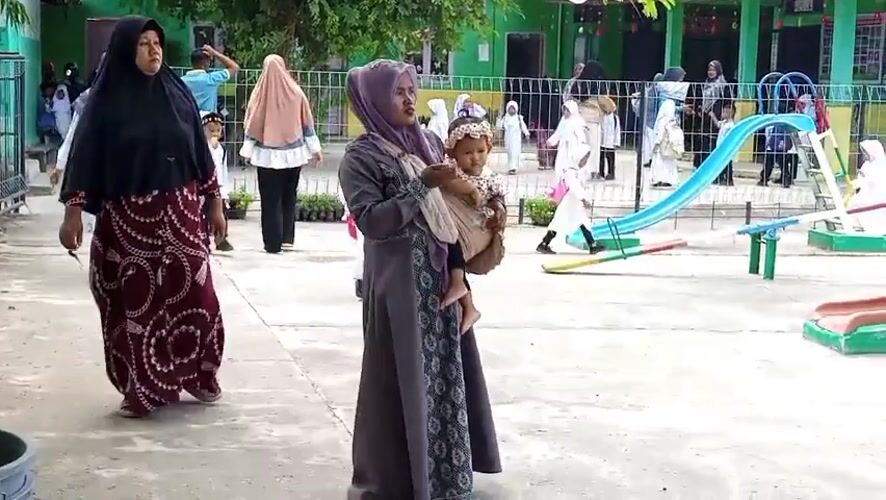 School gathering outside in Uteunreutoh, Aceh, Indonesia