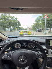 Mercedes driver waits behind green Camaro at Bulgarian traffic light