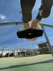 Child enjoys sunny morning playground activities in Khimki, Russia