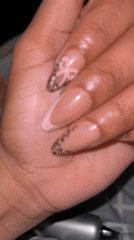 Person shows off nail art in Galax bedroom