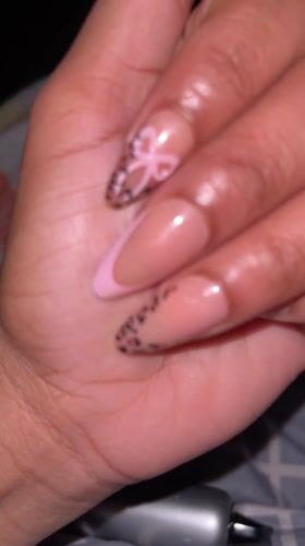 Person shows off nail art in Galax bedroom