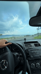 Driver travels scenic coastal road in Nesebar, Bulgaria