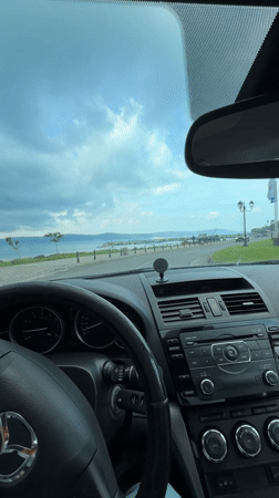 Driver travels scenic coastal road in Nesebar, Bulgaria