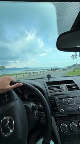 Driver travels scenic coastal road in Nesebar, Bulgaria