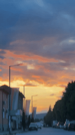 Sunset colors illuminate street scene in Septemvri, Bulgaria