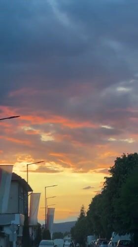 Sunset colors illuminate street scene in Septemvri, Bulgaria
