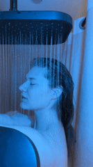 Person showers under blue light in Kazan bathroom