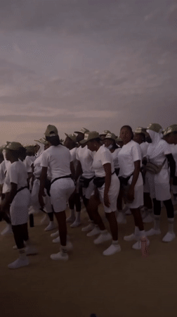 Youth group in white uniforms gather for morning ritual in Maiduguri