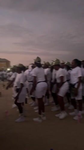 Youth group in white uniforms gather for morning ritual in Maiduguri