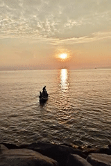 Fishing boat spotted at sunset off Lhokseumawe coast