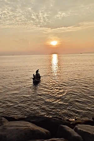 Fishing boat spotted at sunset off Lhokseumawe coast