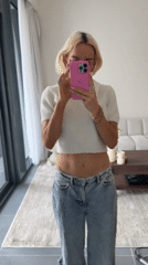 Woman Takes Mirror Selfie in Dubai Room