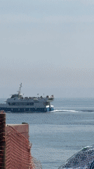 Ferry spotted on Barcelona waterfront with yellow signage visible
