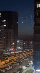 Perm resident captures sunset-to-night transition over urban apartment complex
