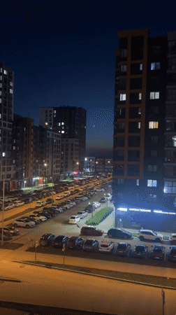 Perm resident captures sunset-to-night transition over urban apartment complex