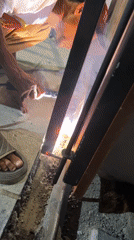 Welder works on metal frame in Banda Aceh