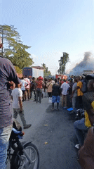 Fire and smoke near Dar es Salaam market, firefighters on scene