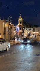 Tel Aviv nighttime street scenes captured with clock tower