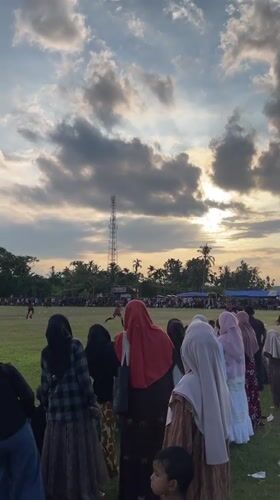 Soccer match draws a crowd in Aratontonmoncrang under dramatic skies