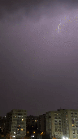 Thunderstorm with purple lightning strikes Tbilisi, Georgia