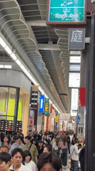 Busy commercial streets documented in Osaka during morning hours