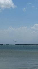 Morning beach scene with water sports at Pandawa Beach