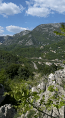 Tourist captures scenic Montenegro mountain views and historic ruins