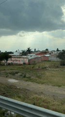 Driver records cloudy rural landscape in Ocotlán, Mexico