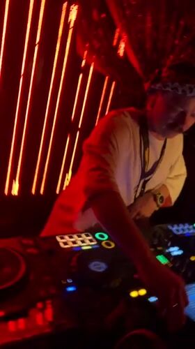 DJ performs with turntables and digital console in Belgrade